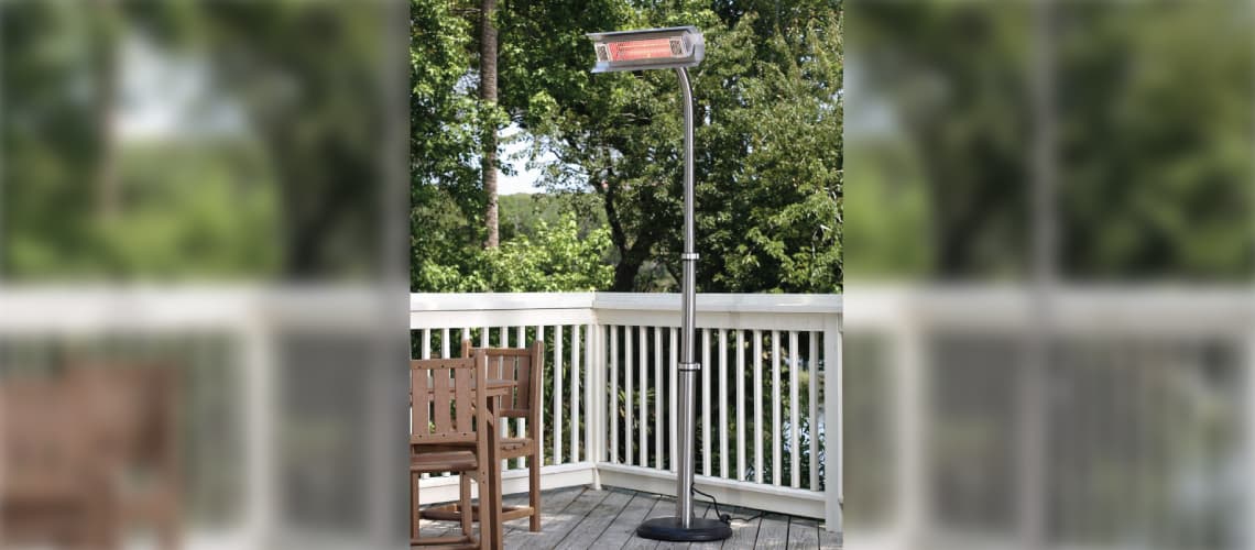 Residential deck with gray deck planks, white railing and a Fire Sense 02117 1500W Telescoping Offset Pole Mounted Infrared Patio Heater